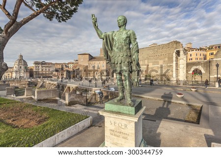 ROMA, ITALY - JANUARY 25, 2015: Bronze statue of the roman emperor Nerva with ruins of roman forum