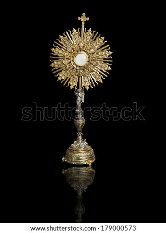 A Catholic priest santisimo host at Communion A Catholic priest santisimo host at Communion