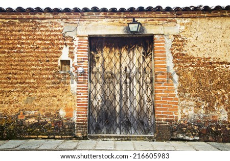 A vintage old wood door on the town of Jalisco, Mexico, America