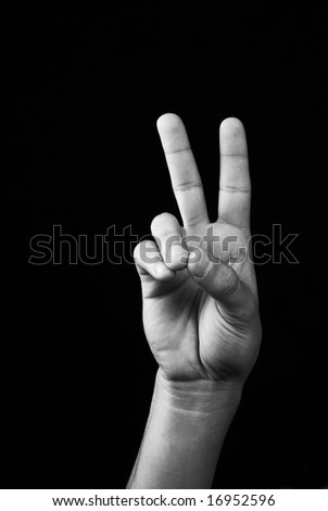 stock photo Hand with victory and peace and love signal