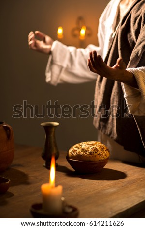 Scene, of Jesus Christ blessing the bread and wine during the last supper with his apostles