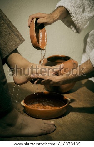 Jesus Christ washing the feet of his disciples in sign of humility and service
