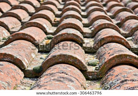 Closeup of the dirty and worn roof on an old house in the village