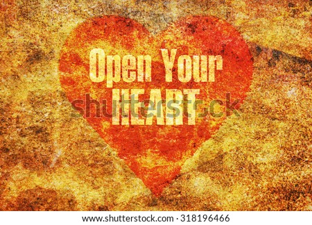 Text message Open Your Heart written with golden letters on a red heart