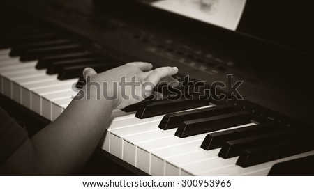 Piano music pianist hand playing, image hand black and white,