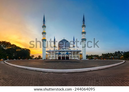 View of panoramic Sultan Salahuddin Abdul Aziz Shah mosque during sunset, Malaysia. Image has grain or blurry or noise and soft focus when view at full resolution. (Shallow DOF, slight motion blur)
