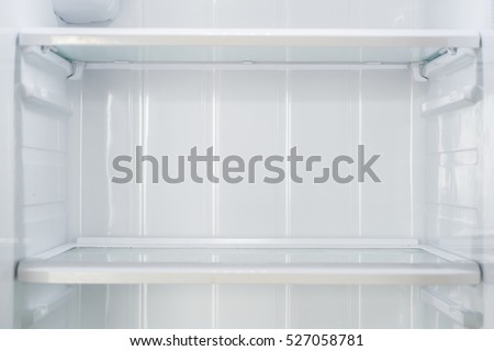 Empty open fridge with shelves, refrigerator.