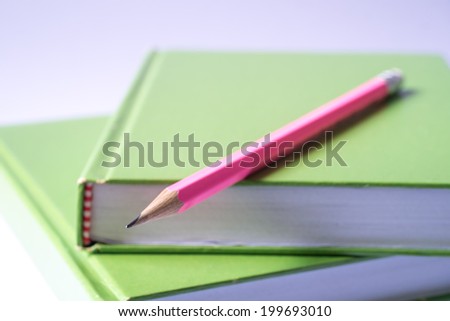 Green Book And Pencil