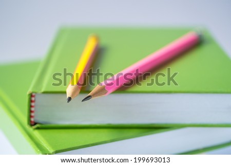 Green Book And Pencils