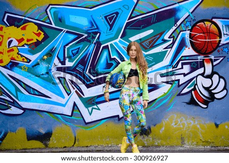 Elegant girl on graffiti background