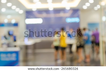 Blurred of people walking in shopping center,test mobile phone shop.