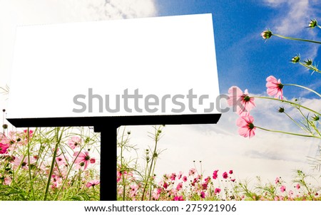 Blank billboard with cloudy, blue sky and flower background.