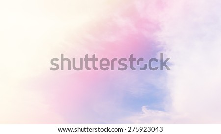 blurred of cloud background with a pastel colored orange to blue gradient.