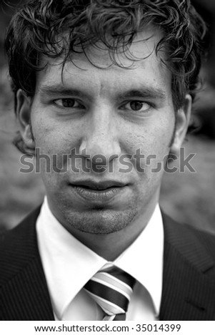 young business man portrait black and white