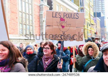 MONTREAL - MARCH 29: A woman holds a sign during a pro-choice rally in Montreal, organized by women\'s rights groups who oppose to Bill 20, which would limit access to abortions.
