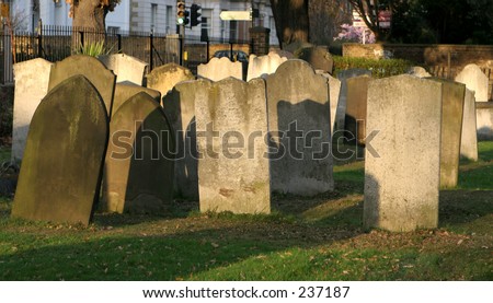 Crowded church yard, with gravestones  in the evening sun, St. Margaret\'s Church, Blackheath, UK