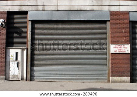 roller shutter on back street of soho, London UK.