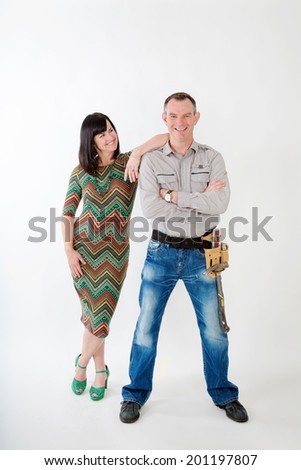 Handy man with tool belt, and woman