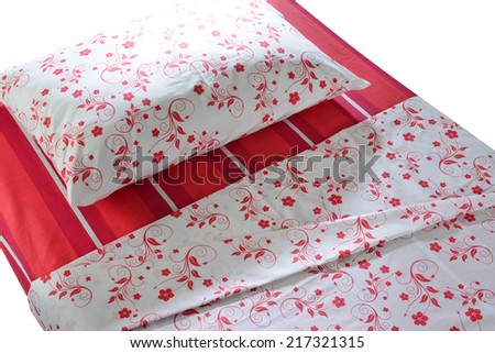 Bed covered with bed spreads and soft pillow.