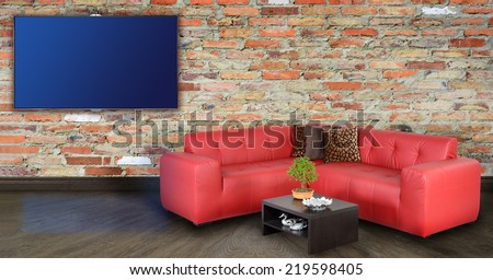 Living room with tv on wall.