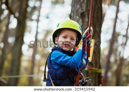 Happy little boy having fun outdoor, playing and doing activities. Happy Childhood concept
