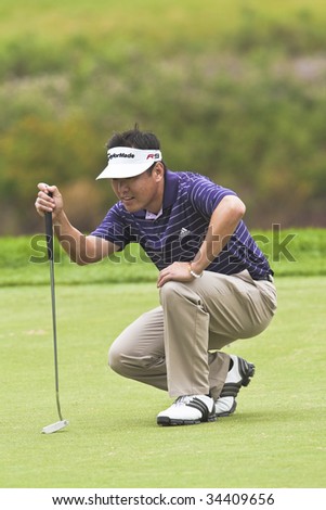 OAKVILLE, ONTARIO - JULY 22: Golfer Charlie Wi lines up a putt  during a pro-am event at the Canadian Open golf on July 22, 2009 in Oakville, Ontario.
