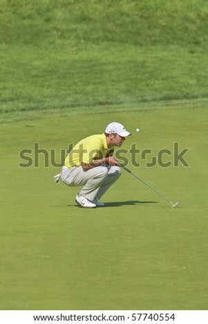 TORONTO, ONTARIO - JULY 21:English golfer Paul Casey lines up a putt during a pro-am event at the RBC Canadian Open golf on July 21, 2010 on Toronto, Ontario.