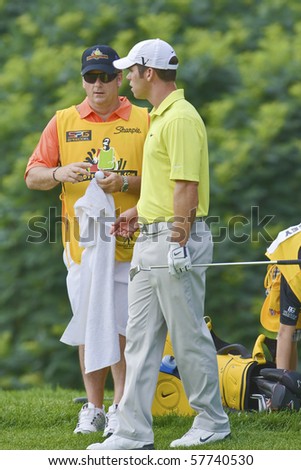 TORONTO, ONTARIO - JULY 21:English golfer Paul Casey andf his caddy during a pro-am event at the RBC Canadian Open golf on July 21, 2010 on Toronto, Ontario.