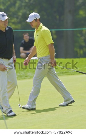 TORONTO, ONTARIO - JULY 21:English golfer Paul Casey follows his tee shot during a pro-am event at the RBC Canadian Open golf on July 21, 2010.