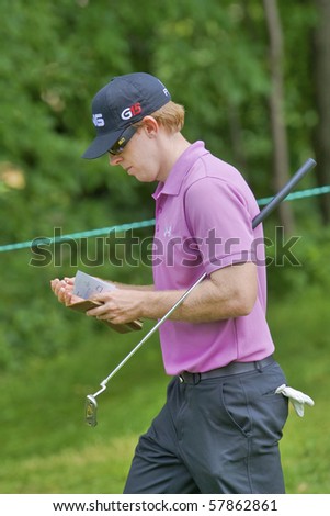 TORONTO, ONTARIO - JULY 21: U.S. golfer Hunter Mahan makes notes as he exits a green during a pro-am event at the RBC Canadian Open golf on July 21, 2010 in Toronto, Ontario