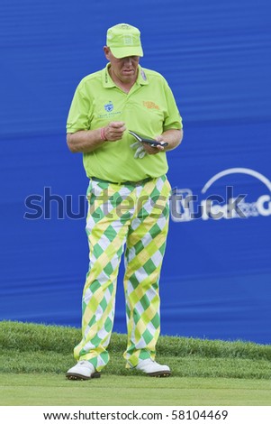 TORONTO, ONTARIO - JULY 21: US golfer John Daly checks his notes during a pro-am event at the RBC Canadian Open golf, St. George\'s; Golf and Country Club;  July 21, 2010 in Toronto, Ontario