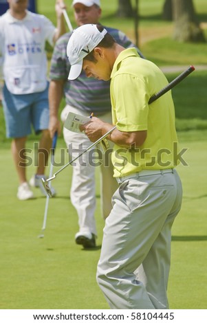 TORONTO, ONTARIO - JULY 21 : English golfer Paul Casey checks his notes during a pro-am event at the RBC Canadian Open golf on  July 21, 2010 in Toronto, Ontario