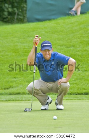 TORONTO, ONTARIO - JULY 21 : South African golfer Retief Goosen lines up a putt during a pro-am event at the RBC Canadian Open golf on July 21, 2010 in Toronto, Ontario