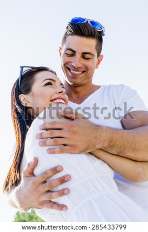 Beautiful couple hugging on a beautiful summer day