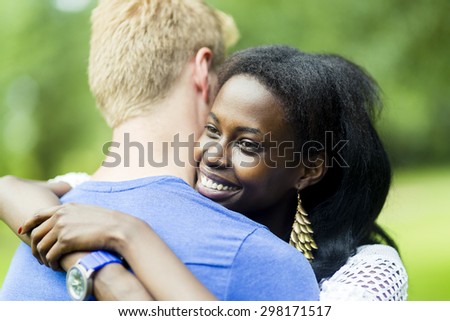 Couple in love hugging peacefully outdoors and being truly happy. Feeling of security and serenity