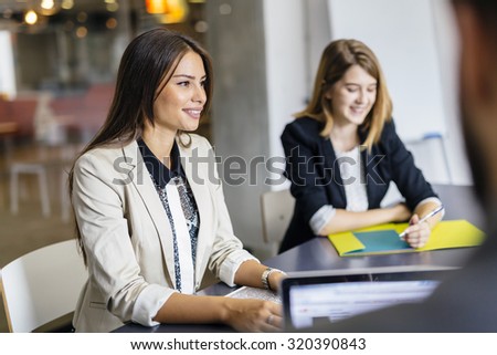 Beautiful businesswoman working in office and smiling