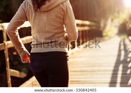 Female jogger exercising outdoors in nature