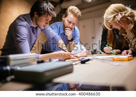 Group of designer working on project in workshop