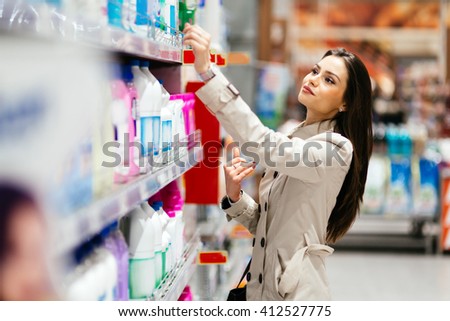 Beautiful  brunette woman shopping in supermarket