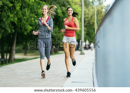 Fit women jogging outdoors and living a healthy lifestyle