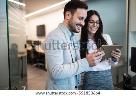 Business people having fun and chatting at workplace office