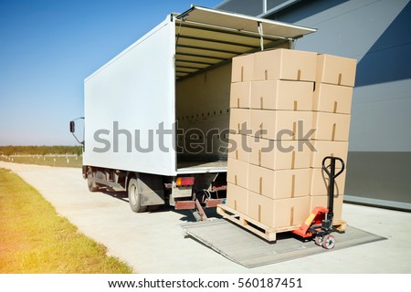 Truck transporting goods packed in boxes from warehouse