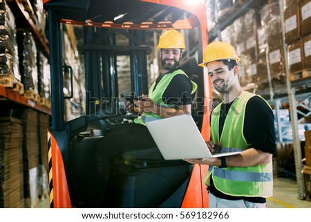 Logistics people working in warehouse
