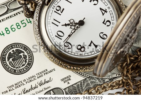 Time and money concept image. Pocket watch and US currency