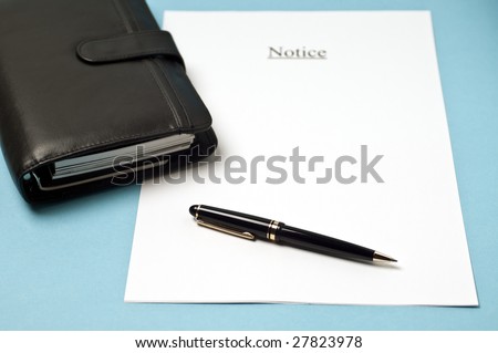 a sheet of paper and a date book