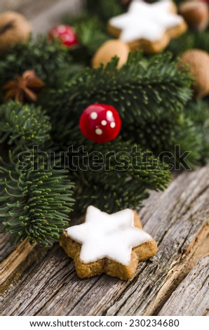 Christmas cookies with fir branches and cinnamon sticks