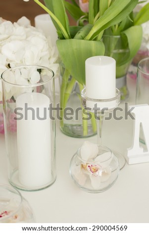 Wedding Table Decoration. Table set for a wedding dinner. Beautiful flowers on table in wedding day