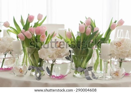 Wedding Table Decoration. Table set for a wedding dinner. Beautiful flowers on table in wedding day