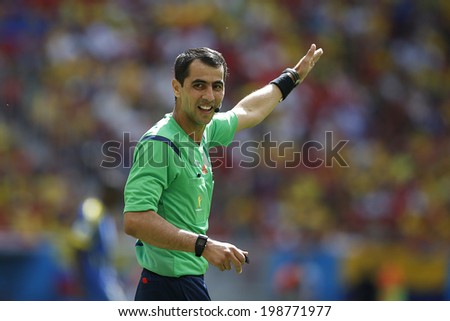 BRASILIA, BRAZIL - June 15, 2014: The referee Rashvan Irmatov during the 2014 World Cup Group Group E game between Switzerland and Ecuador at Estadio Nacional Mane Garrincha. No Use in Brazil.