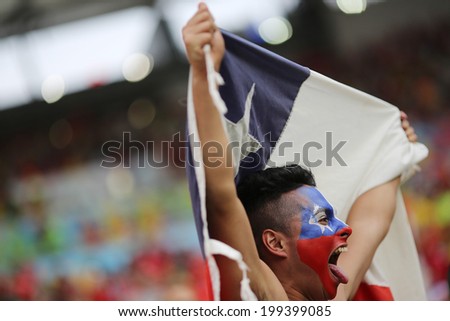 RIO DE JANEIRO, BRAZIL - June 18, 2014: Soccer fans celebrating at the 2014 World Cup Group B game between Spain and Chile at Maracana Stadium. No Use in Brazil.